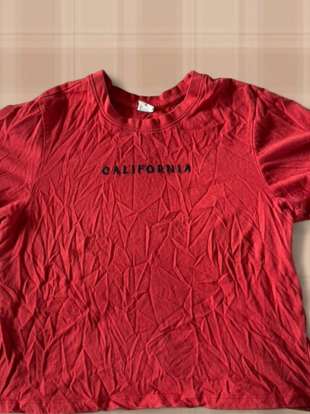 Red California graphic tee with design on the back. Size: S